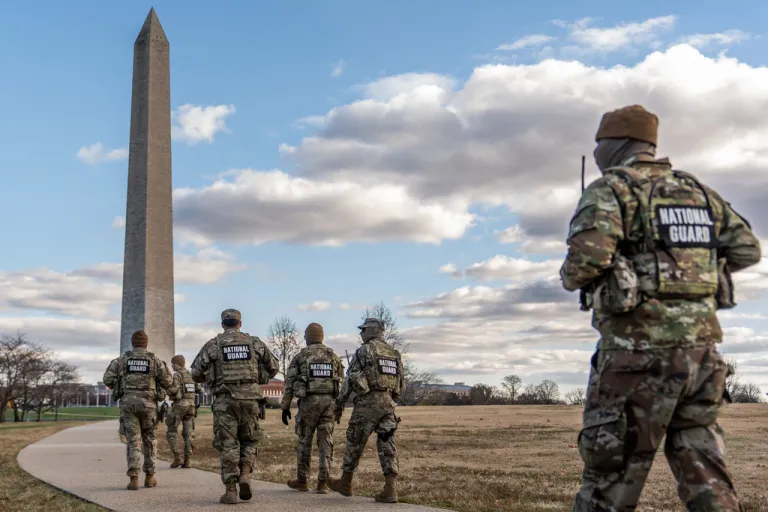 National Guardsmen patrol in front of the Washington Monument on the National Mall, Friday, Nov. 28, 2025, in Washington. (AP Photo/Julia Demaree Nikhinson)