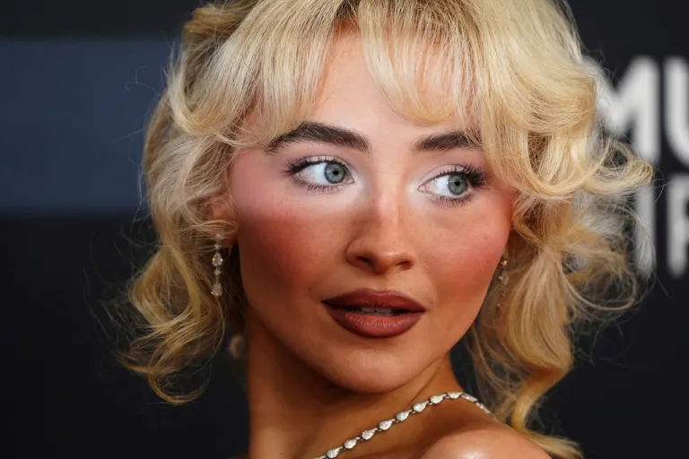 Sabrina Carpenter poses for photos.