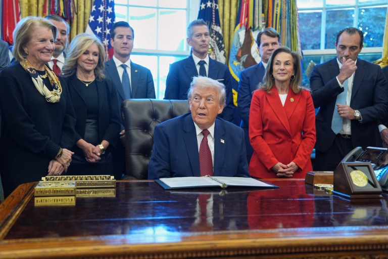 President Donald Trump sitting in Oval Office