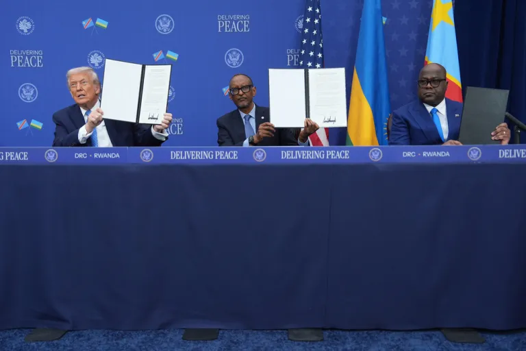 President Donald Trump, Rwanda's President Paul Kagame and Democratic Republic of Congo President Felix-Antoine Tshisekedi, during a signing ceremony at the U.S. Institute of Peace, Thursday, Dec. 4, 2025, in Washington.