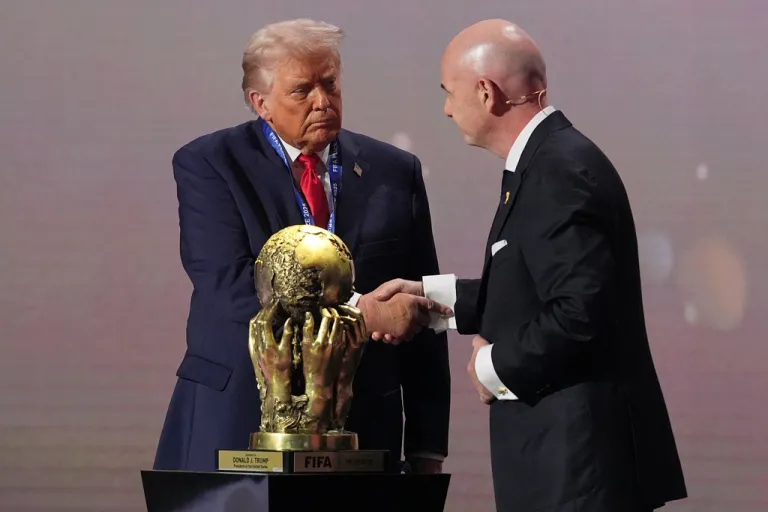 President Donald Trump receives the FIFA Peace Prize from FIFA President Gianni Infantino.