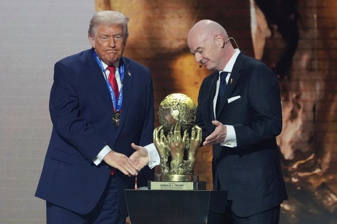 FIFA President Gianni Infantino presents President Donald Trump with the FIFA Peace Prize.