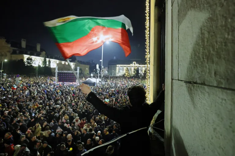 A student waves a Bulgarian flag.