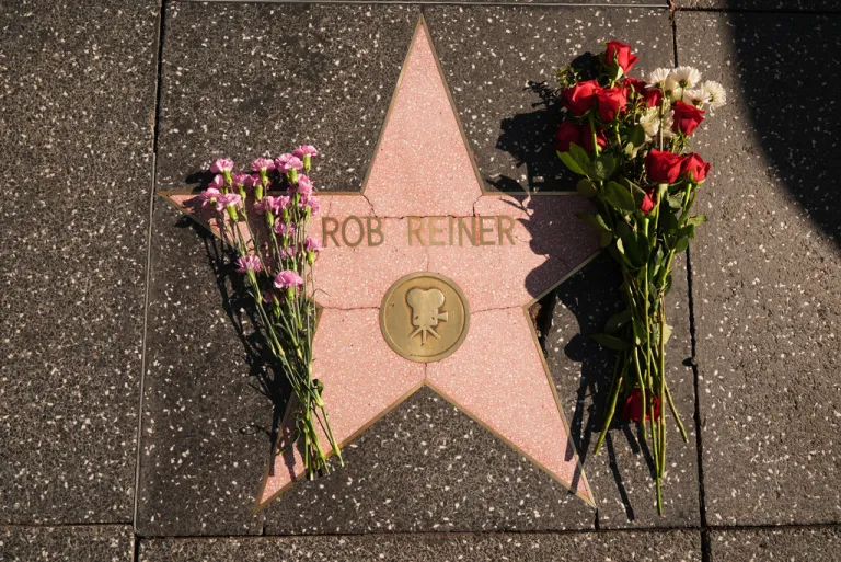 Flowers cover the Walk of Fame star for Rob Reiner.