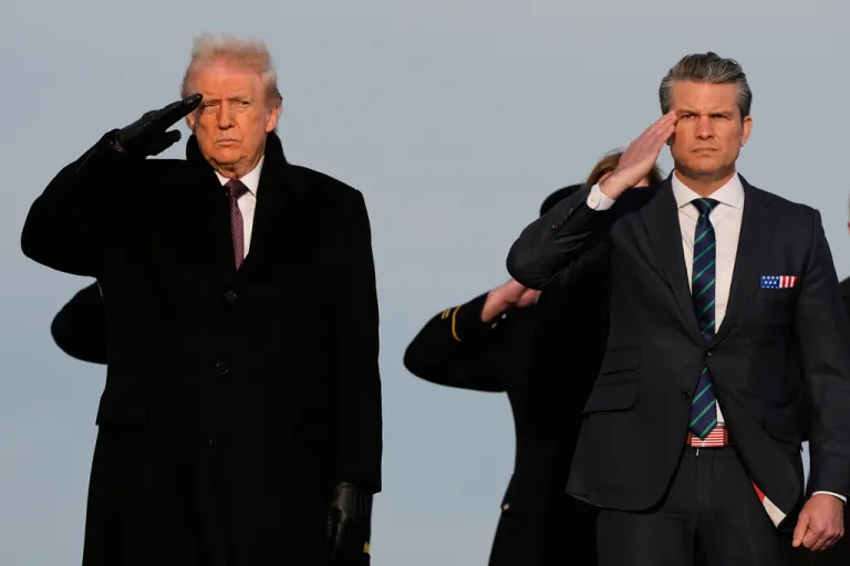 President Donald Trump and Defense Secretary Pete Hegseth salute