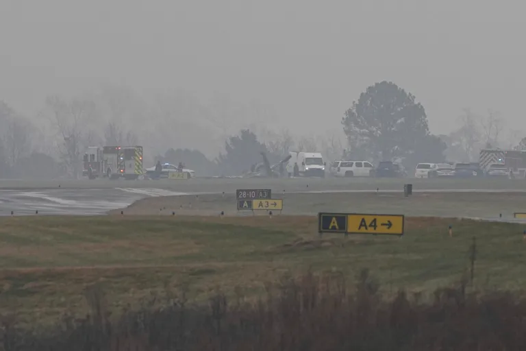 First responders tend to the scene of a reported plane crash at a regional airport in Statesville, N.C., Thursday, Dec. 18, 2025.
