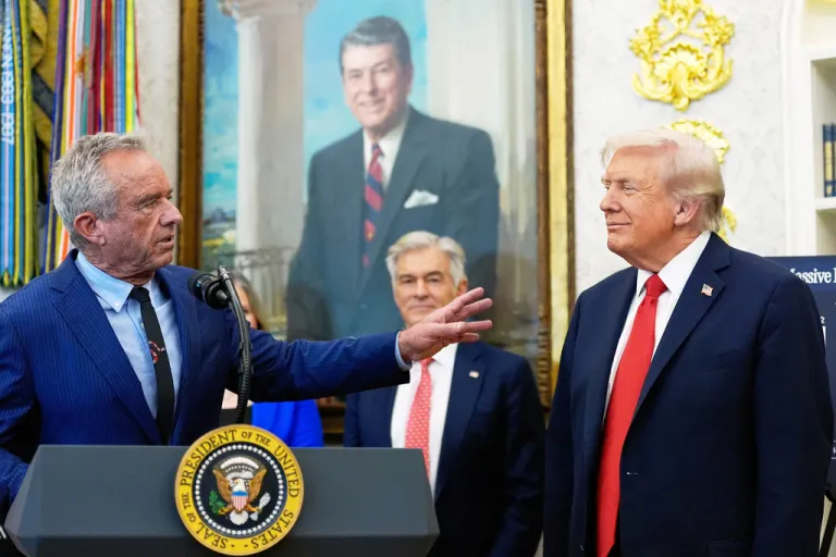 President Donald Trump listens as Health and Human Services Secretary Robert F. Kennedy Jr., speaks in the Oval Office of the White House, Oct. 16, 2025.