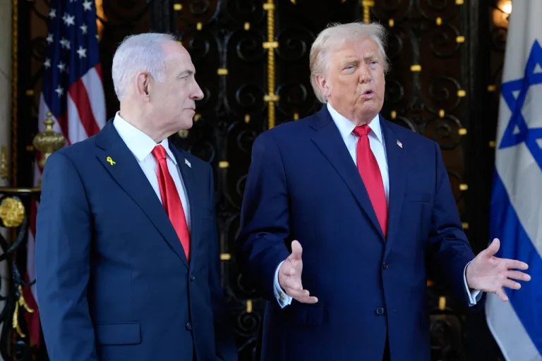 President Donald Trump speaks to reporters as he greets Israeli Prime Minister Benjamin Netanyahu at his Mar-a-Lago club.