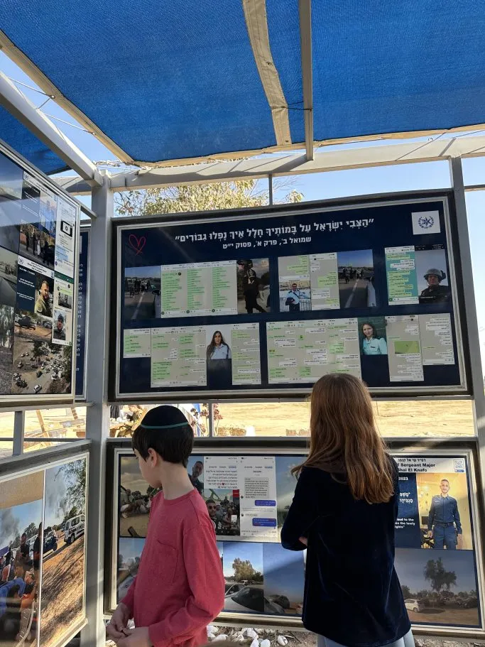 Visitors look at a display on the site of the Oct. 7, 2023, Hamas attack on the Nova Music Festival in Israel.