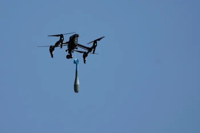 FILE - A drone carries a mortar shell as soldiers take part in the U.S.-led Immediate Response 25 military exercise in Petrochori, Greece, Wednesday, June 4, 2025. (AP Photo/Thanassis Stavrakis, File)