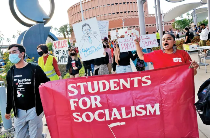 Leftist students march in protest at Arizona State University in Tempe, Arizona, Dec. 1, 2021. (Matt York/AP)