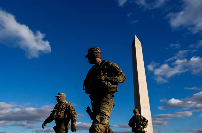 National Guardsmen patrol in front of the Washington Monument on the National Mall, Friday, Nov. 28, 2025, in Washington. (Julia Demaree Nikhinson/AP)