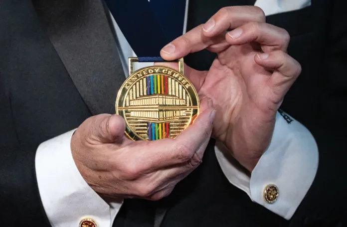 Kennedy Center Honoree Paul Stanley of KISS shows his Kennedy Center Honors medal to members of the
media in Washington, D.C., Dec. 7, 2025. (Bonnie Cash/UPI/Newscom)
