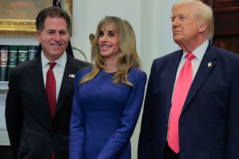 Tech billionaires Michael Dell (L) and Susan Dell join U.S. President Donald Trump to make an announcement about 
