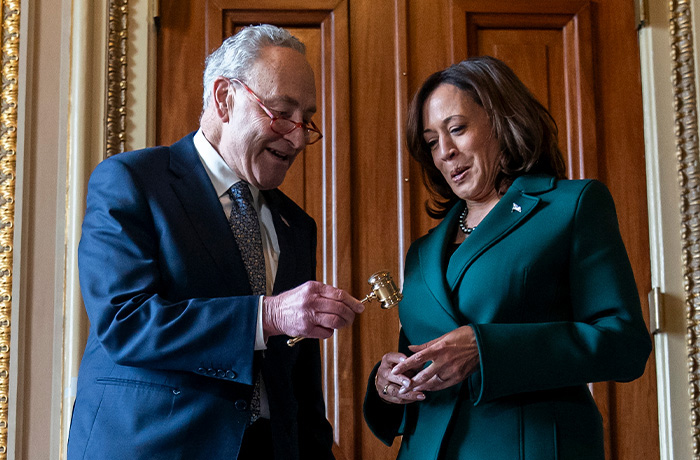 Then-Senate Majority Leader Sen. Chuck Schumer (D-NY) presents Vice President Kamala Harris with a golden gavel after she cast the 32nd tie-breaking vote in the Senate, the most ever cast by a vice president on Dec. 5, 2023. (Stephanie Scarbrough/AP)