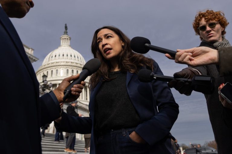 Rep. Alexandria Ocasio-Cortez (D-NY) takes questions from reporters on the Capitol steps.