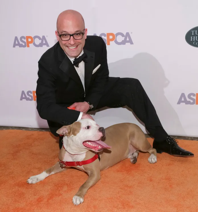 ASPCA President and CEO Matt Bershadker poses with a dog. 