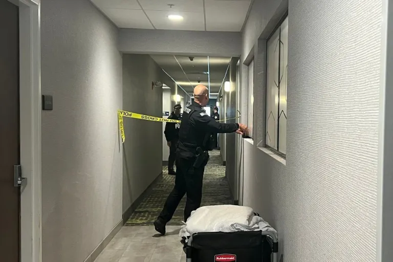 Police search a hotel room in Rhode Island.