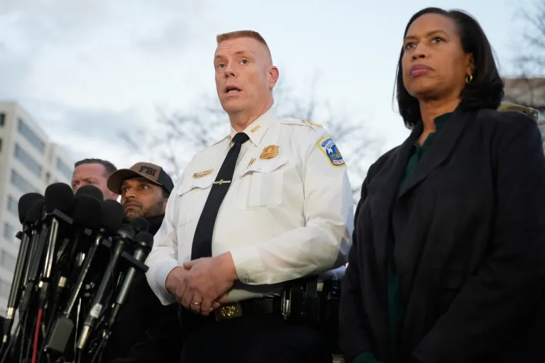 Flanked by District of Columbia Mayor Muriel Bowser, right, Executive Assistant Chief, Metropolitan Police Department Jeffery Carroll speaks during a press conference following the shooting of two National Guard soldiers near the White House Wednesday, Nov. 26, 2025, in Washington.