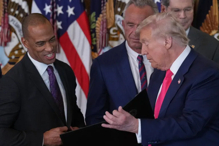 President Donald Trump talks with Housing and Urban Development Secretary Scott Turner and Health and Human Services Secretary Robert F. Kennedy Jr.