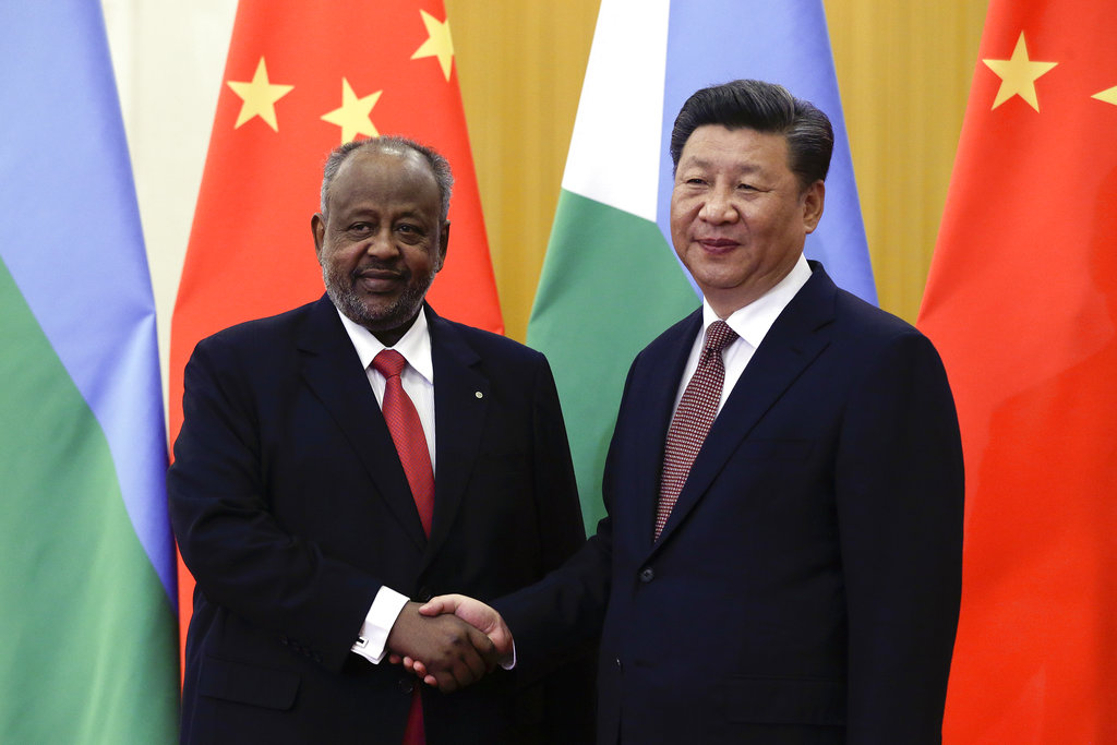 Djibouti's President Ismail Omar Guelleh poses with Chinese President Xi Jinping.