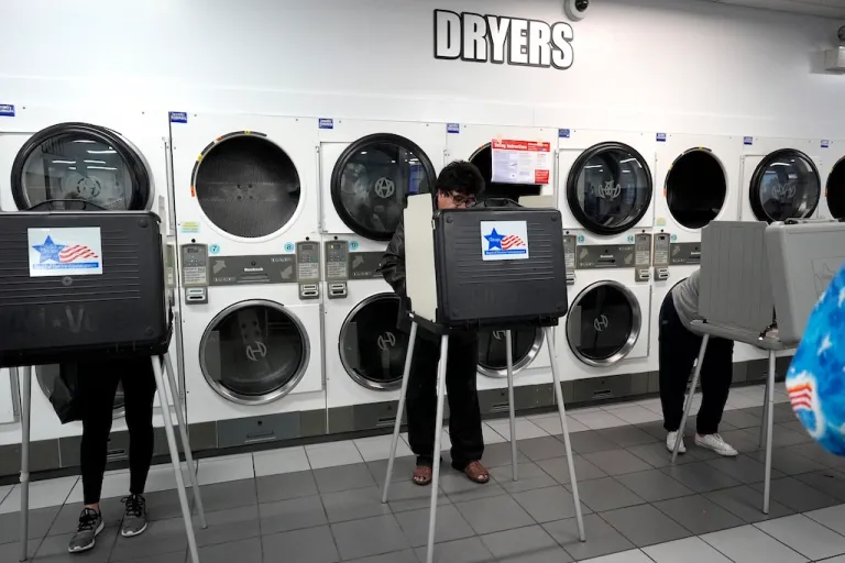 Voters cast their ballots on Election Day at Su Nueva Lavanderia in Chicago.