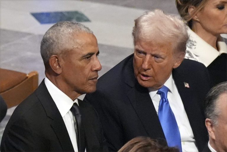 Former President Barack Obama talks with President-elect Donald Trump before the state funeral for former President Jimmy Carter at Washington National Cathedral.