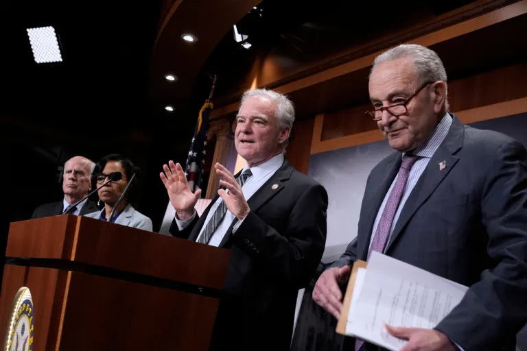 Sen. Tim Kaine, D-Va., center, joined by, from left, Sen. Peter Welch, D-Vt., Sen. Angela Alsobrooks, D-Md., and Senate Minority Leader Chuck Schumer, D-N.Y., speaks to reporters at the Capitol, in Washington, Wednesday, April 2, 2025
