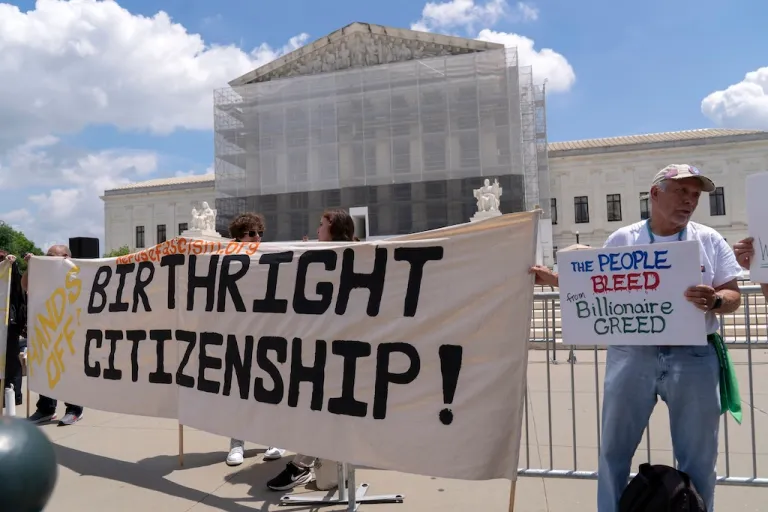 FILE - Demonstrators holds up a banner during a citizenship rally outside of the Supreme Court in Washington, May 15, 2025. (AP Photo/Jose Luis Magana, File)