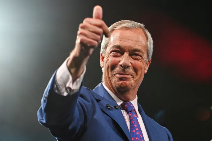 Nigel Farage gives a thumbs up to supporters at a rally in Birmingham