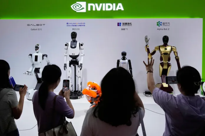 Visitors at the China International Exhibition Center look at Nvidia-built robots in Beijing
