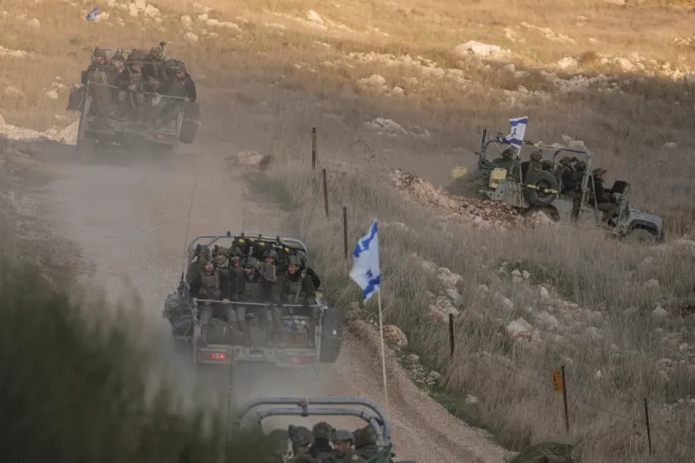 Israeli soldiers cross the security fence moving toward the so-called Alpha Line that separates the Israeli-annexed Golan Heights from Syria.