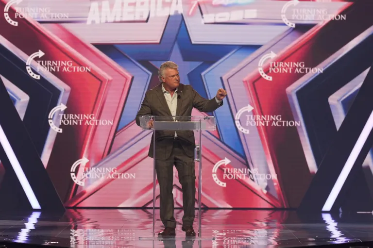 Rep. Mike Collins (R-GA) speaks during Turning Point USA's AmericaFest 2025.
