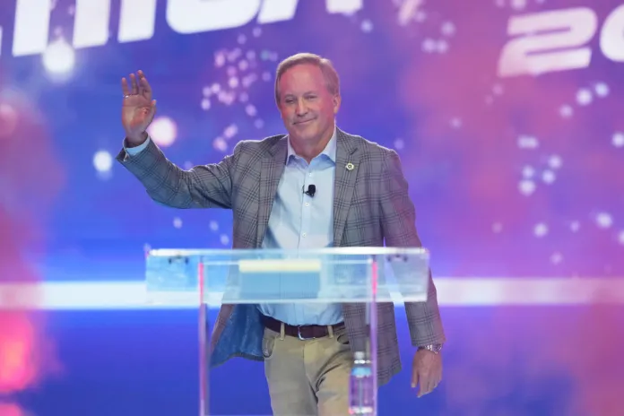 Texas Attorney General Ken Paxton takes the stage during Turning Point USA's AmericaFest 2025, Saturday, Dec. 20, 2025, in Phoenix.