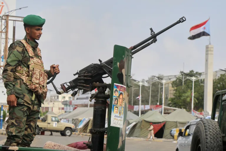 A Southern Yemen soldier of Southern Transitional Council stands at a check point.
