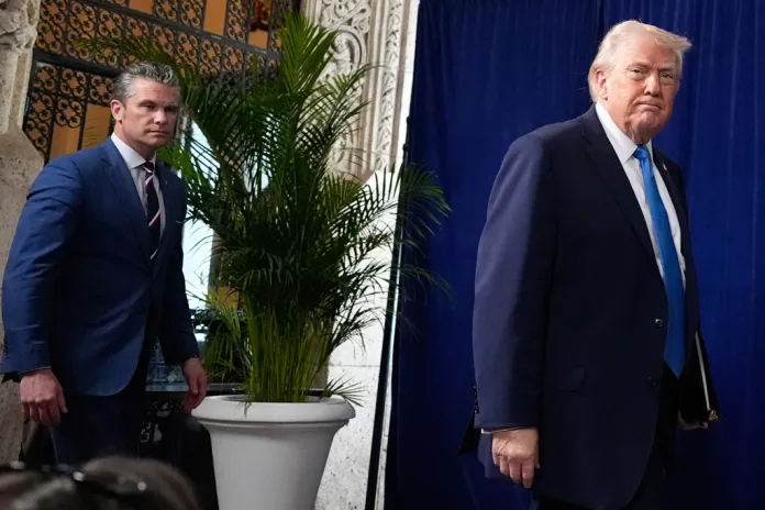 President Donald Trump arrives to speak at his Mar-a-Lago club, Saturday, Jan. 3, 2026, in Palm Beach, Fla., with Defense Secretary Pete Hegseth.