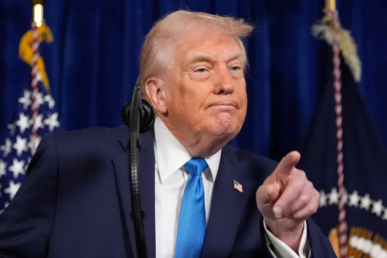 President Donald Trump points to a reporter to ask a question during a news conference at Mar-a-Lago, Saturday, Jan. 3, 2026, in Palm Beach, Fla.