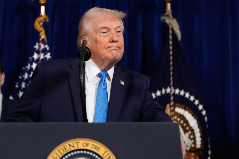 President Donald Trump listens to a question from a reporter during a news conference at Mar-a-Lago.