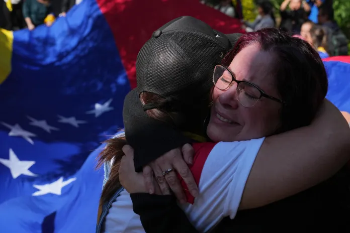 Venezuelan opposition supporters embrace each other in Mexico City