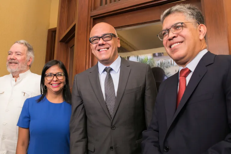 Constitutional Assembly President Delcy Rodriguez, and her brother, Minister of Communications Jorge Rodriguez, flanked by diplomat Roy Chaderton.