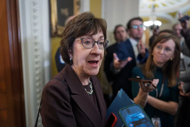 Sen. Susan Collins, R-Maine, chair of the Senate Appropriations Committee, is met by reporters outside the Senate chamber, at the Capitol in Washington, Tuesday, Jan. 6, 2026.