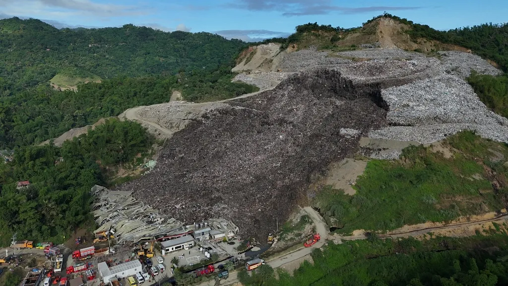 Filipino rescuers detect ‘signs of life’ in garbage avalanche that killed 4 and left dozens missing