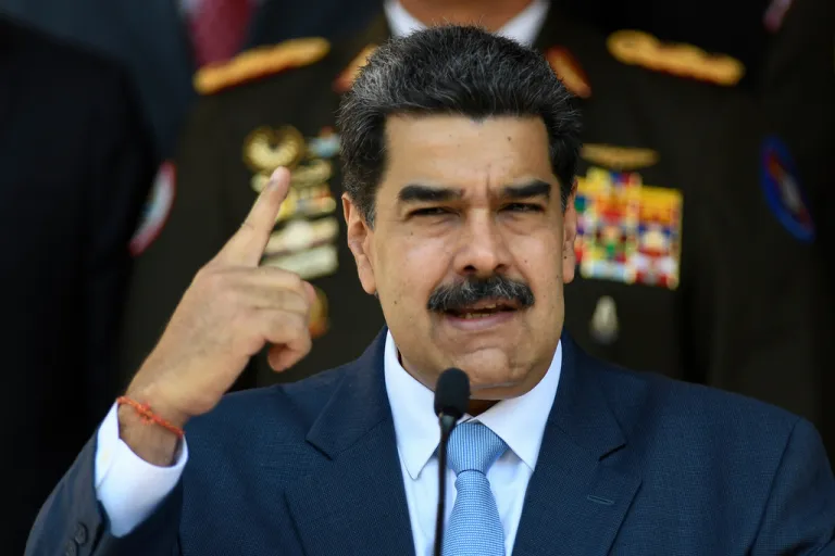 In this March 12, 2020, photo, Venezuelan President Nicolas Maduro gives a press conference at the Miraflores presidential palace in Caracas, Venezuela.