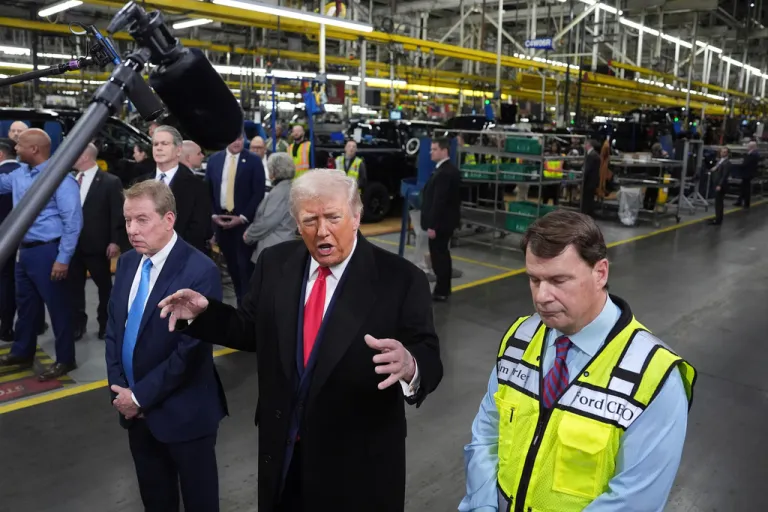 President Donald Trump speaks as Bill Ford, Executive Chairman of Ford, left, and Jim Farley, CEO of Ford, listen during a tour of the Ford River Rogue complex