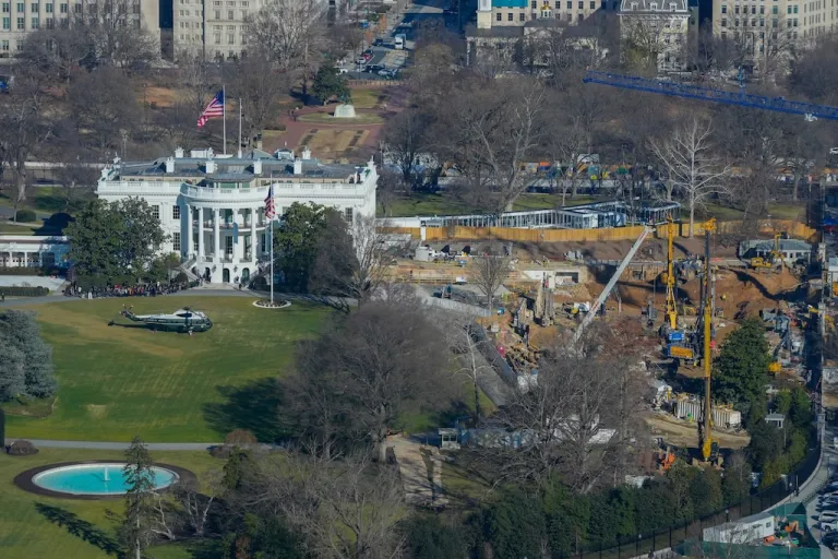 Marine One helicopter is seen on the South Lawn of the White House to transport President Donald Trump to nearby Andrews Air Force Base, as work continues on the construction of the ballroom at the White House, Tuesday, Jan., 13, 2026, in Washington, where the East Wing once stood. (AP Photo/Pablo Martinez Monsivais)