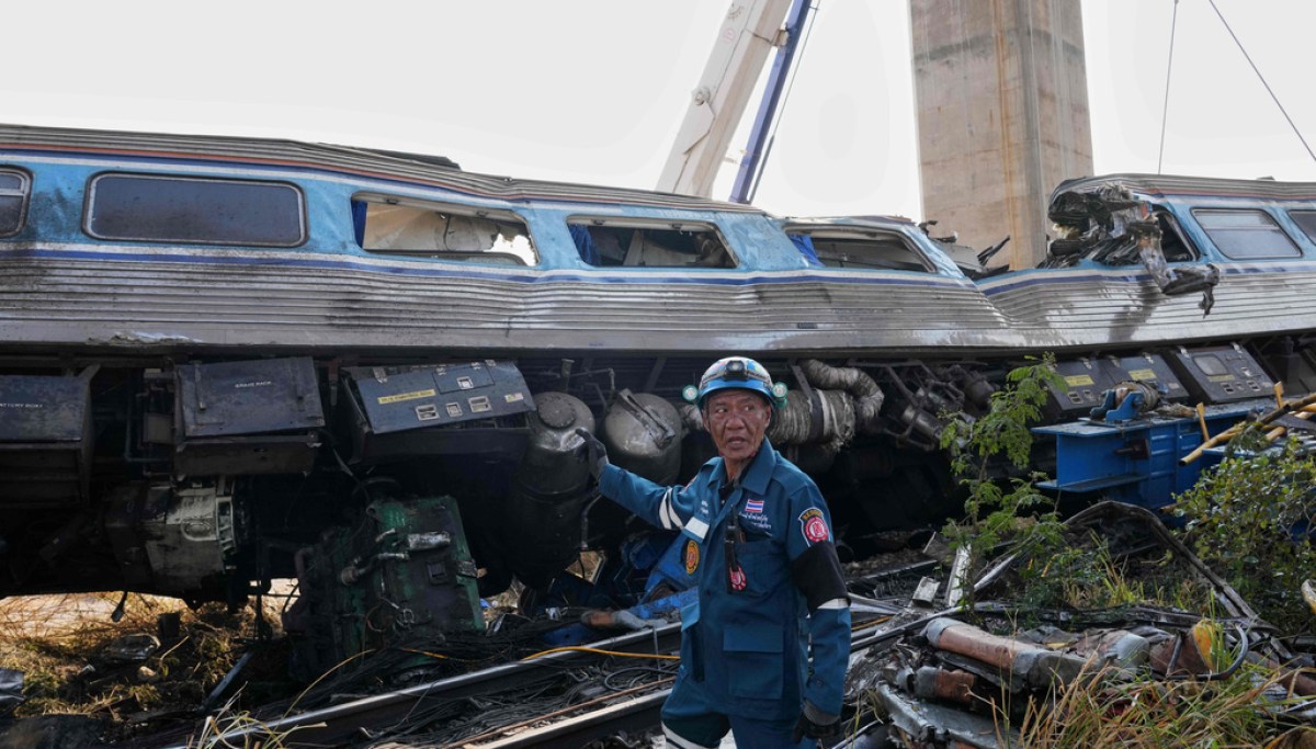 A construction crane falls onto a moving train in Thailand, killing at least 32 people