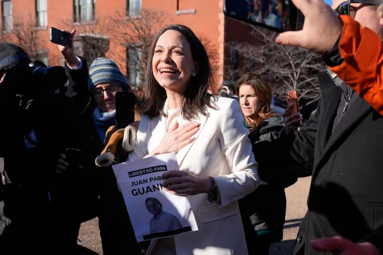 Venezuelan opposition leader María Corina Machado greets supporters on Pennsylvania Avenue near the White House after meeting with Trump Thursday, Jan. 15, 2026, in Washington.