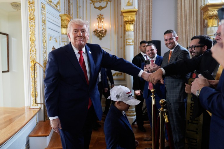 President Donald Trump shakes hands with supporters at a dedication ceremony for a portion of Southern Boulevard, which the Town of Palm Beach Council recently voted to rename,