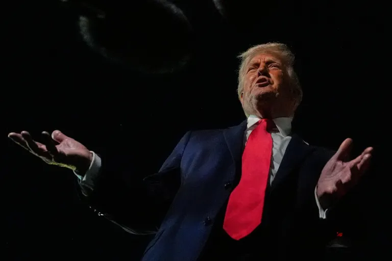 President Donald Trump speaks to reporters before boarding Air Force One