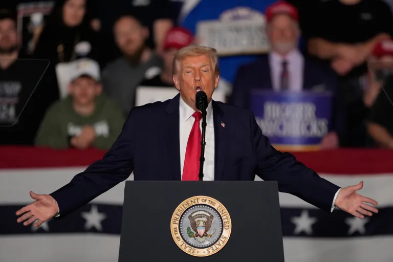 President Donald Trump speaks about the economy at a rally in Iowa.